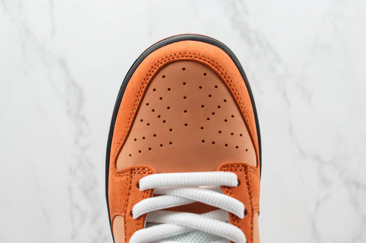 Designer Concepts x SB Dunk Low “Orange Lobster”