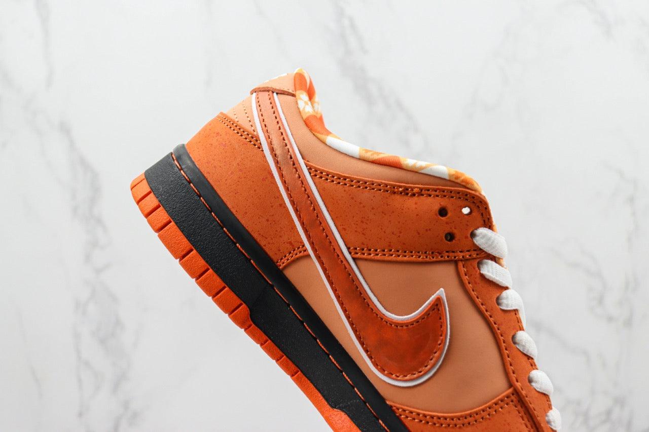 Designer Concepts x SB Dunk Low “Orange Lobster”