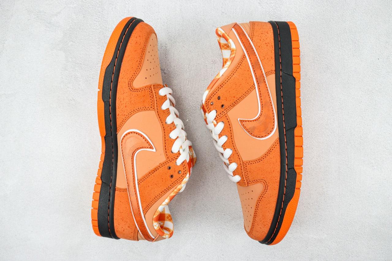 Designer Concepts x SB Dunk Low “Orange Lobster”